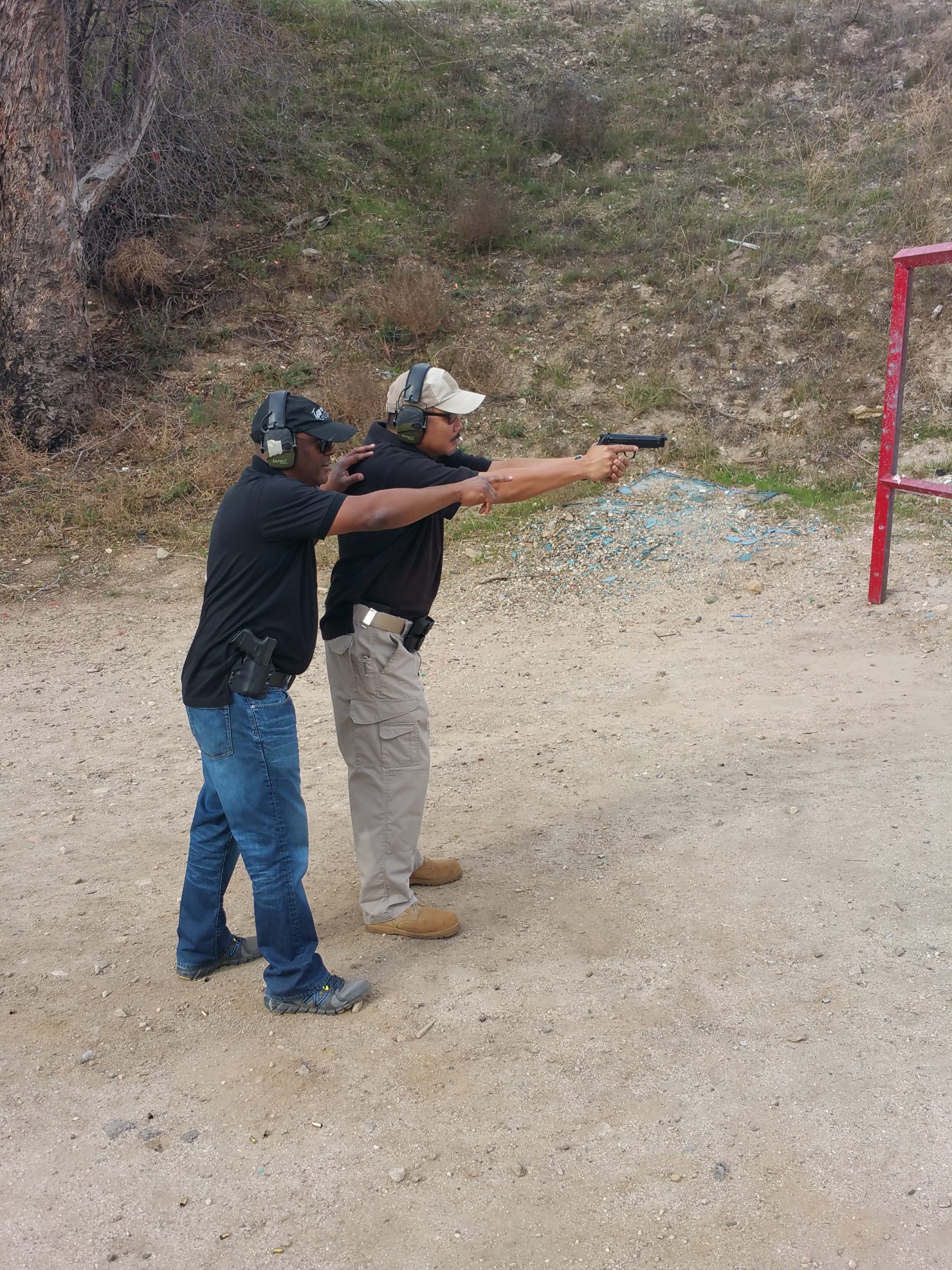 Two men training at range